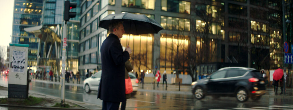 Man in Warsaw with an umbrella